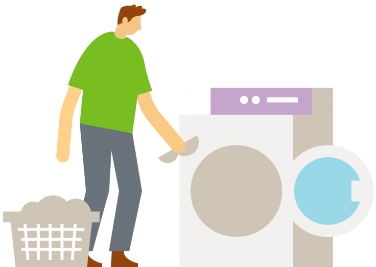 Man placing items in washing machine. 